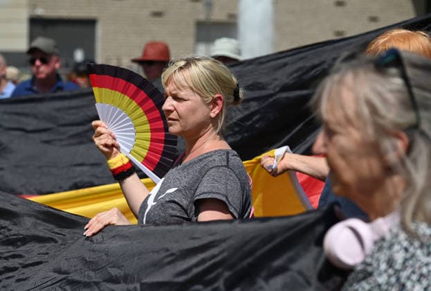 A rally in support of a petition for the resignation of Friedrich Merz in Berlin BERLIN, GERMANY - JULY 12: People holding German flags and posters take part in a rally supporting a petition calling for the resignation of German Chancellor Friedrich Merz in Berlin, Germany, on July 12, 2026. Volodymyr Sindieiev Anadolu Berlin Germany. Editorial use only. Please get in touch for any other usage.  Copyright: x2026xAnadoluxVolodymyrxSindieievx