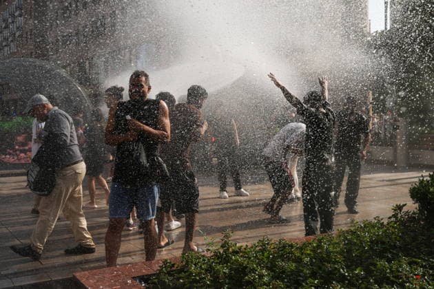 ARMENIA, YEREVAN - JULY 12, 2026: Citizens enjoy dousing each other during the traditional feast of Vardavar celebrated by the Armenian Apostolic Church to mark the Transfiguration of Christ Yerevan Armenia  - ZUMAt113 20260712_zaa_t113_267 Copyright: xAlexanderxPatrinx