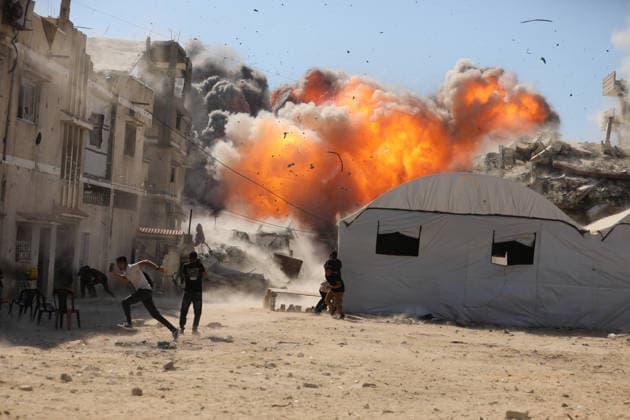 Palestinians seek shelter during Israeli airstrike in Gaza City Palestinians attempt to take cover from a massive explosion following an Israeli airstrike targeting a blacksmith workshop in the al-Sabra neighborhood of Gaza City, on July 12, 2026. Photo by Belal Osama apaimages Gaza Gaza Strip Palestinian Territory 120726_Gaza_BO_3_00(8) Copyright: xapaimagesxBelalxOsamax xapaimagesx