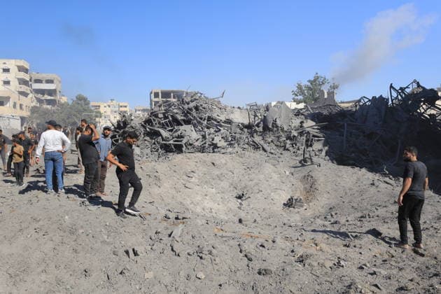 Israeli attacks on Gaza continue in violation of the ceasefire GAZA CITY, GAZA, PALESTINE - JULY 12: Palestinians inspect the widespread destruction in the area caused by an unmanned aerial vehicle (UAV) strike where the Israeli army targeted several buildings with an UAV on Industrial Street in western Gaza City, Gaza, Palestine, on July 12, 2026. Khames Alrefi Anadolu Gaza City Gaza. Editorial use only. Please get in touch for any other usage.  Copyright: x2026xAnadoluxKhamesxAlrefix