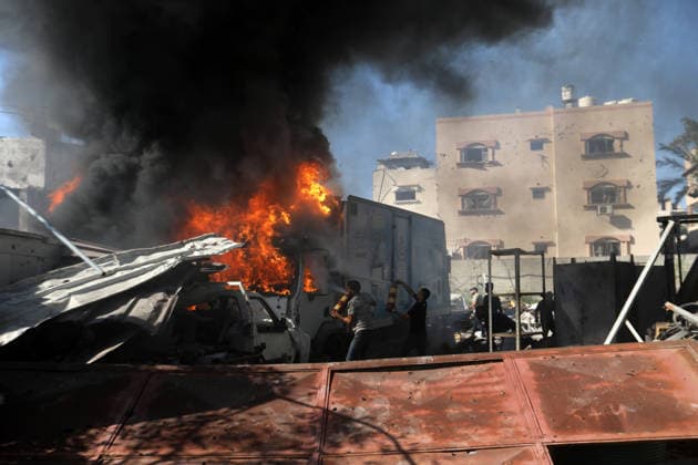 Palestinians inspect damage after Israeli airstrike in Gaza City Palestinians inspect the damage at the site of an Israeli airstrike that targeted a blacksmith workshop in the al-Sabra neighborhood of Gaza City, on July 12, 2026, as Civil Defense firefighters attempts to extinguish a fire that broke out in nearby vehicles and residential buildings following the strike. Photo by Belal Osama apaimages Gaza Gaza Strip Palestinian Territory 120726_Gaza_BO_4_00(32) Copyright: xapaimagesxBelalxOsamax xapaimagesx