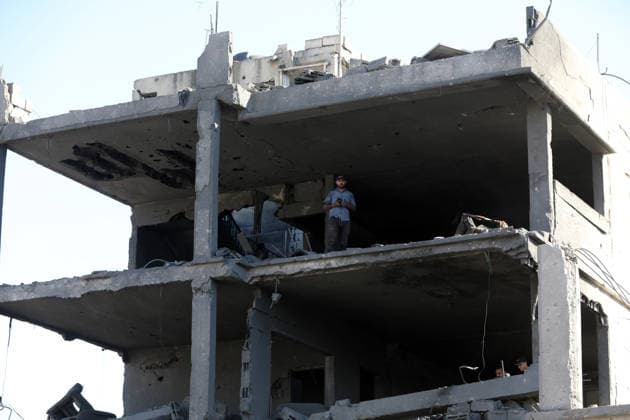 Palestinians inspect damage after Israeli airstrike in Gaza City Palestinians inspect the damage at the site of an Israeli airstrike that targeted a blacksmith workshop in the al-Sabra neighborhood of Gaza City, on July 12, 2026, as Civil Defense firefighters attempts to extinguish a fire that broke out in nearby vehicles and residential buildings following the strike. Photo by Belal Osama apaimages Gaza Gaza Strip Palestinian Territory 120726_Gaza_BO_4_00(27) Copyright: xapaimagesxBelalxOsamax xapaimagesx