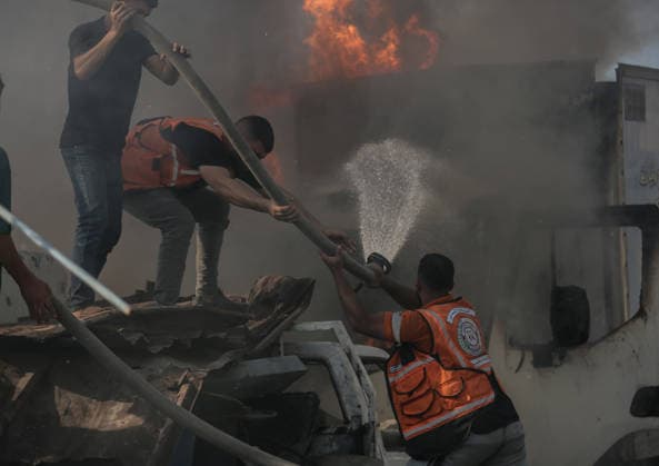 Israeli attacks on Gaza continue in violation of the ceasefire GAZA CITY, GAZA , PALESTINE - JULY 12: Rescuers try to extinguish a fire after the Israeli military targeted several buildings using unmanned aerial vehicles (UAVs) in Al-Sinaa (Industrial) Street in western Gaza City, Palestine on July 12, 2026. The drone-fired missiles caused significant damage and structural ruin across the residential and commercial area. Saeed M. M. T. Jaras Anadolu Gaza City Gaza. Editorial use only. Please get in touch for any other usage.  Copyright: x2026xAnadoluxSaeedxM.xM.xT.xJarasx