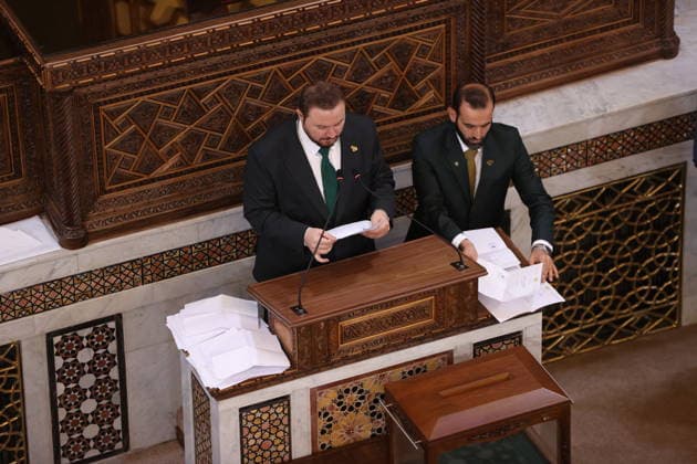 Sharaa calls for new chapter in Syria s history as new parliament convenes DAMASCUS, SYRIA - JULY 12: Syrian legislators cast their votes during the first session of the newly formed People s Assembly at the parliament building following the fall of the Assad regime, in Damascus, Syria, on July 12, 2026. Izz Aldien Alqasem Anadolu Damascus Syria. Editorial use only. Please get in touch for any other usage.  Copyright: x2026xAnadoluxIzzxAldienxAlqasemx