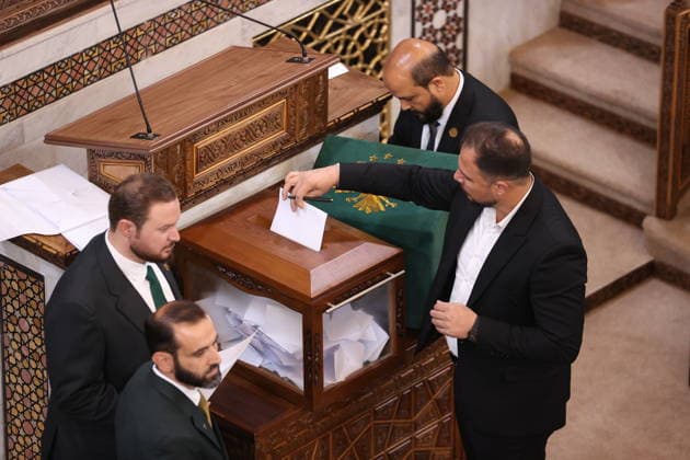 Sharaa calls for new chapter in Syria s history as new parliament convenes DAMASCUS, SYRIA - JULY 12: Syrian legislators cast their votes during the first session of the newly formed People s Assembly at the parliament building following the fall of the Assad regime, in Damascus, Syria, on July 12, 2026. Izz Aldien Alqasem Anadolu Damascus Syria. Editorial use only. Please get in touch for any other usage.  Copyright: x2026xAnadoluxIzzxAldienxAlqasemx