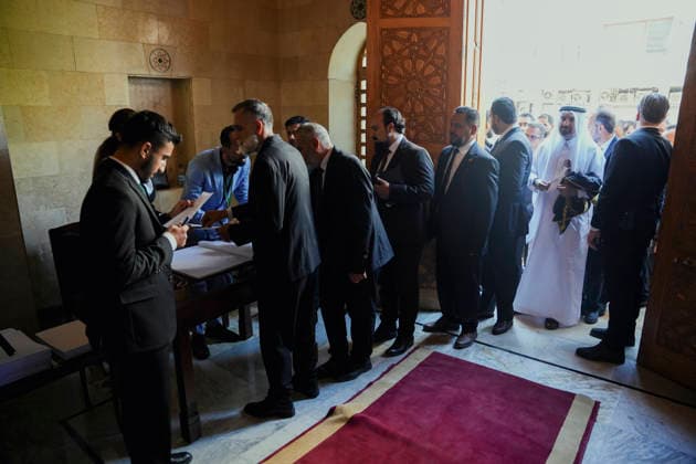 Damascus Syria Parliament First Session Members of Syria s People s Assembly check documents before the first session of the country s new parliament in Damascus, Syria, on July 12, 2026. The 210-member assembly is Syria s first parliament since the fall of the Assad government in December 2024 and is tasked with legislating during the transitional period. Damascus Damascus Syria Copyright: xOmarxAlbamx
