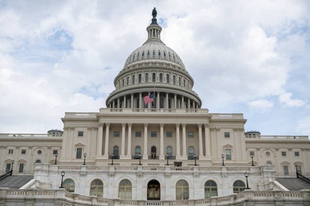 July 12, 2026, Washington, District Of Columbia, United States: U.S. flags fly at half-staff atop the U.S. Capitol following the death of Senator LINDSEY GRAHAM. Washington United States - ZUMAk206 20260712_znp_k206_009 Copyright: xMattxKaminskyx