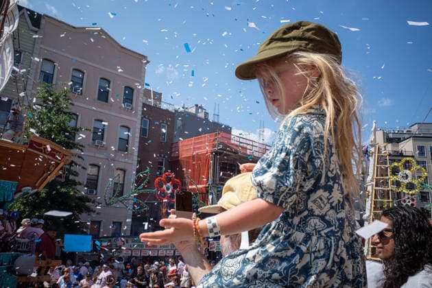 July 12, 2026, New York, New York, USA: A young girl sits on her fathers shoulders trying to catch somoe confetti as it falls...The Ã¢â‚¬oeDancing of the GiglioÃ¢â‚¬Â is an annual event, held in Williamsburg, Brooklyn in front of Our Lady of Mount Carmel. The Italian community takes part in a 139 year old tradiontion celebration heritage, faith and culture. New York USA - ZUMAp288 20260712_znp_p288_021 Copyright: xSyndixPilarx