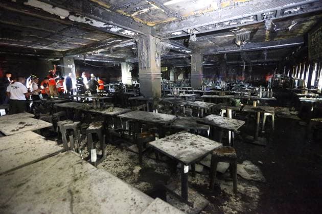 (260713) -- BANGKOK, July 13, 2026 -- Rescuers work at a pub where a fire broke out in Bangkok, Thailand, July 13, 2026. A fire at a pub near Lat Phrao Road in Bangkok s Chatuchak district killed 27 people and injured more than 10 others late Sunday, Thai media reported. The fire broke out at around 11:57 p.m. local time and was later extinguished. The injured were taken to hospitals for treatment. ) (SpotNews) THAILAND-BANGKOK-PUB-FIRE RachenxSageamsak 