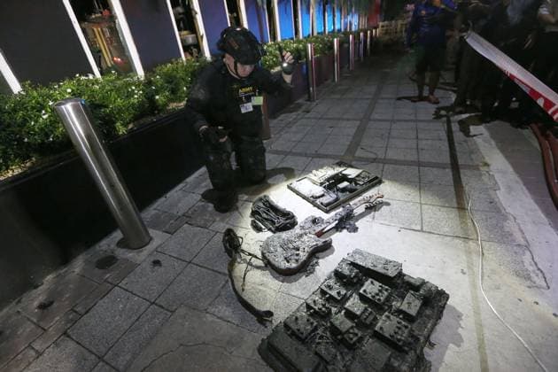 (260713) -- BANGKOK, July 13, 2026 -- A rescuer checks items burned at a pub in Bangkok, Thailand, July 13, 2026. A fire at a pub near Lat Phrao Road in Bangkok s Chatuchak district killed 27 people and injured more than 10 others late Sunday, Thai media reported. The fire broke out at around 11:57 p.m. local time and was later extinguished. The injured were taken to hospitals for treatment. ) (SpotNews) THAILAND-BANGKOK-PUB-FIRE RachenxSageamsak 