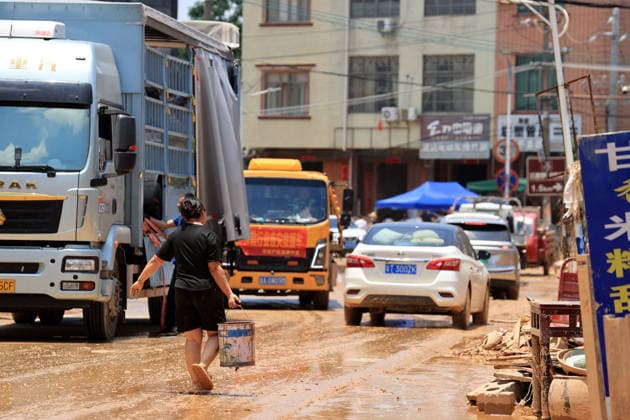 GUIGANG, CHINA - JULY 12: A villager clean furniture soaked by floodwaters on July 12, 2026 in Guigang, Guangxi Zhuang Autonomous Region of China. Floodwaters have receded and residents lives have returned to normal.  Copyright: xVCGx 111653899643