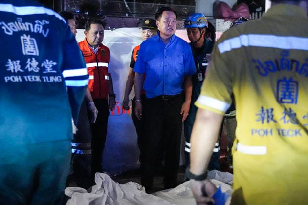 Bangkok Pub Fire Kills At Least 27 People Thailand Prime Minister Anutin Charnvirakul, in blue, inspects the site of a fire at a pub in Bangkok, Thailand, on July 13, 2026. A large fire engulfed a pub in Bangkok early on Monday morning local time, resulting in the deaths of at least 27 people before firefighters brought the blaze under control, officials said. Bangkok Bangkok Thailand  Copyright: xAnusakxLaowilasx originalFilename: laowilas-notitle260713_nphz3.jpg