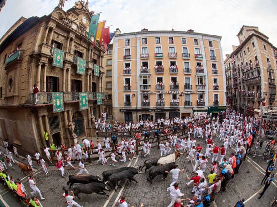 July 13, 2026, Pamplona, Navarre, Spain: People take part in the traditional encierro (bull-run) of the San Fermin Festival in Pamplona, Spain on July 13, 2026. The bull-running fiesta is held annually from 06 to 14 July in commemoration of the city s patron saint. Visitors from all over the world attend the festival. Many of them physically participate in the highlight event - the running of the bulls, or encierro - where they attempt to outrun the animals along a route through the narrow streets of Pamplona s old city. Pamplona Spain - ZUMAa206 20260713_zsp_a206_007 Copyright: xRubenxAlbarranx