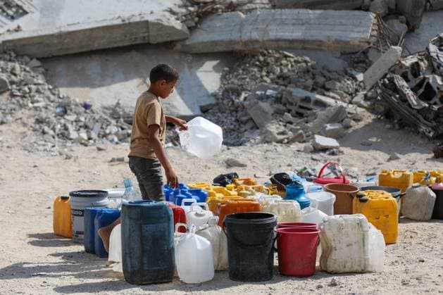 July 13, 2026, Khan Younis, Palestine, State of: KHAN YOUNIS, GAZA STRIP Ã¢â‚¬ JULY 13, 2026: Palestinians wait in line for hours to collect water from a mobile water tanker in central Khan Younis, southern Gaza Strip, on July 13, 2026. With severe shortages of clean water and soaring summer temperatures, residents continue to struggle to secure their daily water supply as the humanitarian crisis deepens. JNA PRESS Khan Younis Palestine, State of - ZUMAq101 20260713_zna_q101_082 Copyright: xRamzixAbuxAmerx
