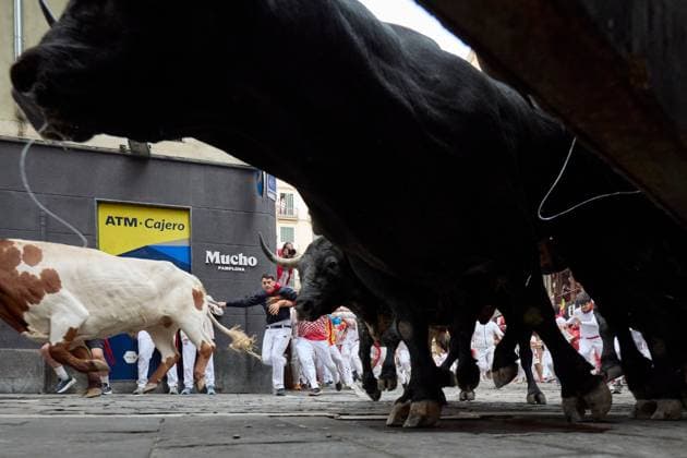 July 13, 2026, Pamplona, Spain: PAMPLONA, SPAIN Ã¢â‚¬ JULY 13, 2026: Bulls from the renowned Miura ranch in Seville charge through the Mercaderes corner during the seventh encierro of the San FermoÂ­n festival in Pamplona, northern Spain, on July 13, 2026. The Miura bull run traditionally concludes the annual festival, drawing thousands of runners and spectators to the historic streets of the Navarrese capital. JNA Press Pamplona Spain - ZUMAq101 20260713_zna_q101_116 Copyright: xUnaixBeroizx