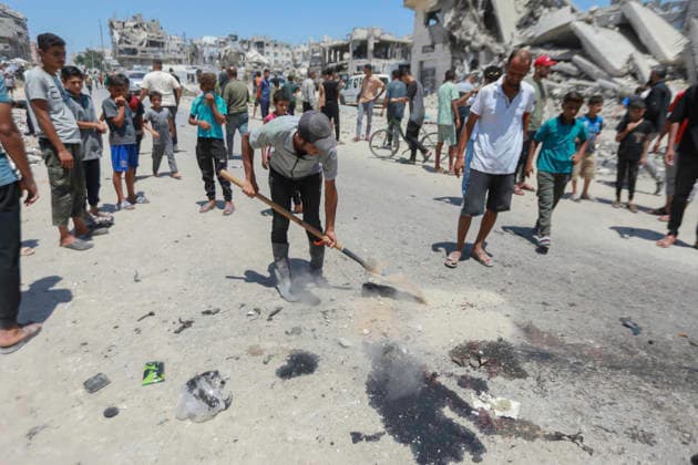 July 13, 2026, Gaza City, Gaza Strip, Palestinian Territory: Palestinians gather at the scene after a motorcycle was struck in western Gaza City. According to medical sources, at least one person was killed in the incident. Emergency teams transferred the victim to a nearby medical facility as authorities assessed the aftermath of the strike. Gaza City Palestinian Territory  - ZUMAz119 20260713_zip_z119_008 Copyright: xSalahxHashemx