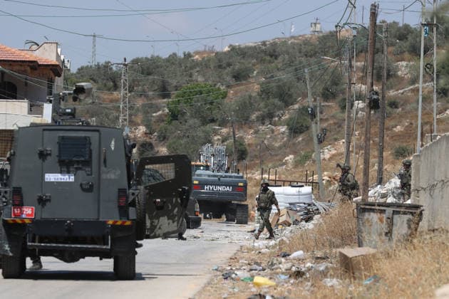 Israel demolishes Palestinian home in the West Bank SALFIT, WEST BANK, PALESTINE - JULY 13: Israeli soldiers take security measures in the area as Israeli forces demolish the home of Palestinian Hasan al-Rinawi with a bulldozer and heavy machinery alleging it was built without a permit in the village of Kufr al Dik, west of Salfit in the West Bank, Palestine, on July 13, 2026. Issam Rimawi Anadolu Salfit West Bank. Editorial use only. Please get in touch for any other usage.  Copyright: x2026xAnadoluxIssamxRimawix