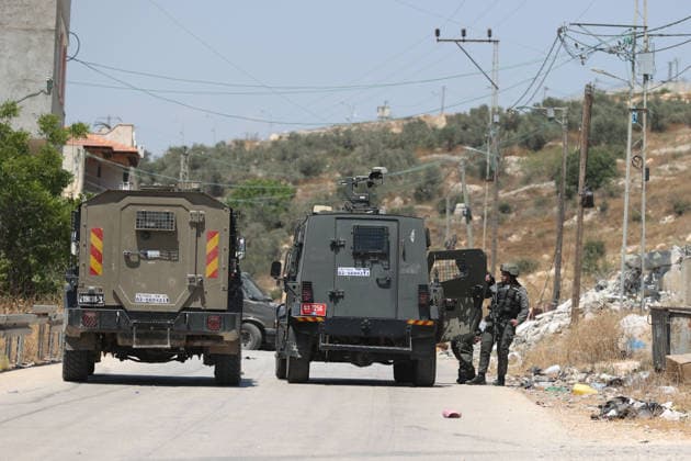 Israel demolishes Palestinian home in the West Bank SALFIT, WEST BANK, PALESTINE - JULY 13: Israeli soldiers take security measures in the area as Israeli forces demolish the home of Palestinian Hasan al-Rinawi with a bulldozer and heavy machinery alleging it was built without a permit in the village of Kufr al Dik, west of Salfit in the West Bank, Palestine, on July 13, 2026. Issam Rimawi Anadolu Salfit West Bank. Editorial use only. Please get in touch for any other usage.  Copyright: x2026xAnadoluxIssamxRimawix
