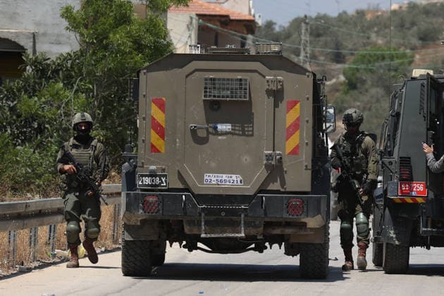 Israel demolishes Palestinian home in the West Bank SALFIT, WEST BANK, PALESTINE - JULY 13: Israeli soldiers take security measures in the area as Israeli forces demolish the home of Palestinian Hasan al-Rinawi with a bulldozer and heavy machinery alleging it was built without a permit in the village of Kufr al Dik, west of Salfit in the West Bank, Palestine, on July 13, 2026. Issam Rimawi Anadolu Salfit West Bank. Editorial use only. Please get in touch for any other usage.  Copyright: x2026xAnadoluxIssamxRimawix