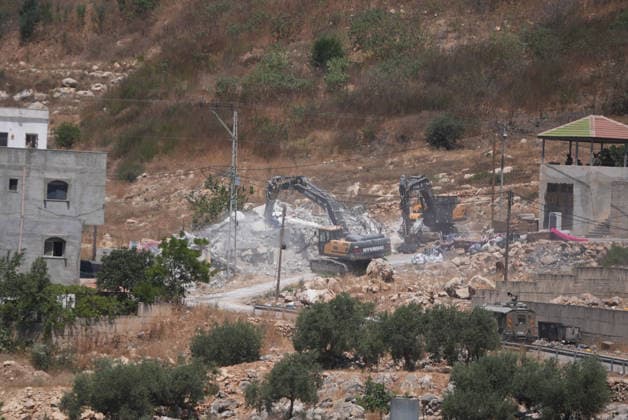 Israel demolishes Palestinian home in the West Bank SALFIT, WEST BANK, PALESTINE - JULY 13: Israeli forces demolish the home of Palestinian Hasan al-Rinawi with a bulldozer and heavy machinery alleging it was built without a permit in the village of Kufr al Dik, west of Salfit in the West Bank, Palestine, on July 13, 2026. Issam Rimawi Anadolu Salfit West Bank. Editorial use only. Please get in touch for any other usage.  Copyright: x2026xAnadoluxIssamxRimawix