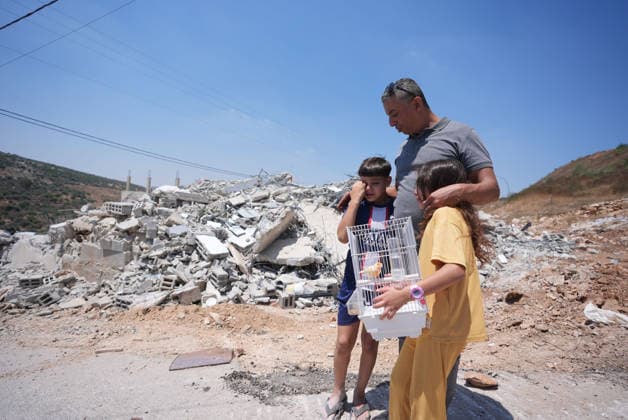 Israel demolishes Palestinian home in the West Bank SALFIT, WEST BANK, PALESTINE - JULY 13: A Palestinian family is seen as Israeli forces demolish the home of Palestinian Hasan al-Rinawi with a bulldozer and heavy machinery alleging it was built without a permit in the village of Kufr al Dik, west of Salfit in the West Bank, Palestine, on July 13, 2026. Issam Rimawi Anadolu Salfit West Bank. Editorial use only. Please get in touch for any other usage.  Copyright: x2026xAnadoluxIssamxRimawix