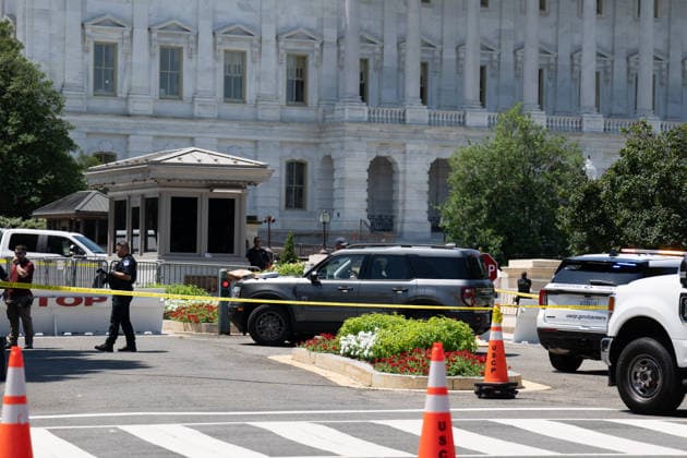 July 13, 2026, Us Capitol, Dc, United States: US Capitol Police inspect a vehicle after a man with a gun and dog entered a restricted area in Washington, D.C. on July 13, 2026. The man and dog were taken into custody. Us Capitol United States - ZUMAl312 20260713_znp_l312_002 Copyright: xAndrewxLeydenx