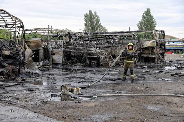 RECORD DATE NOT STATED Russian Attack Damages Bus Depot - Ukraine Firefighters with the State Emergency Service of Ukraine extinguish smoldering hotspots at a bus depot destroyed in a Russian missile and drone attack in Odesa, Ukraine, on July 13, 2026. Russian forces launched a missile and drone attack on the city on the morning of July 13, damaging a transport company, private houses and a sanatorium building. Four people, including a five-year-old girl, were injured (Photo by Nina Liashonok Ukrinform ABACAPRESS.COM) Odesa Ukraine  Copyright: xLyashonokxNina Ukrinform ABACAx