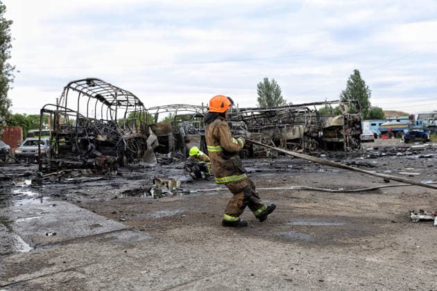 RECORD DATE NOT STATED Russian Attack Damages Bus Depot - Ukraine Firefighters with the State Emergency Service of Ukraine extinguish smoldering hotspots at a bus depot destroyed in a Russian missile and drone attack in Odesa, Ukraine, on July 13, 2026. Russian forces launched a missile and drone attack on the city on the morning of July 13, damaging a transport company, private houses and a sanatorium building. Four people, including a five-year-old girl, were injured (Photo by Nina Liashonok Ukrinform ABACAPRESS.COM) Odesa Ukraine  Copyright: xLyashonokxNina Ukrinform ABACAx