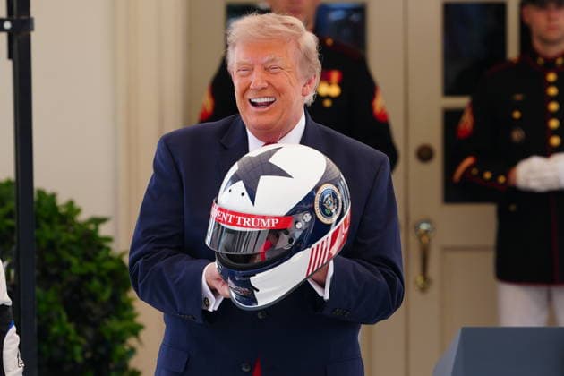 President Donald Trump holds a racing helmet while hosting top IndyCar drivers at the White House in Washington, DC to promote the inaugural Freedom 250 Grand Prix on Monday, July 13, 2026. The race will be held in DC on August 22-23, 2026.  WASP20260713108a AaronxSchwartz