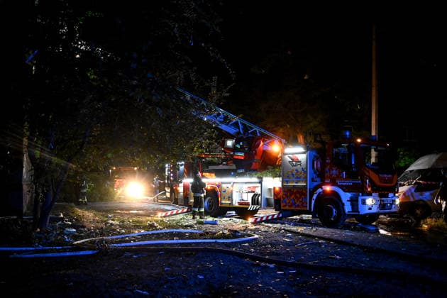RECORD DATE NOT STATED A firefighter with the State Emergency Service of Ukraine extinguishes a fire from an aerial ladder at a residential building set ablaze by a nighttime Russian drone attack in Zaporizhzhia, Ukraine, on July 12, 2026. Six people, including a 15-year-old boy, were injured in the attack (Photo by Dmytro Smolienko Ukrinform) Nighttime Russian drone strike hits Zaporizhzhia  Copyright: xDmytroxSmolienkox