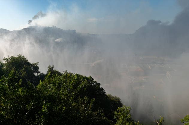 Wildfire erupts near Campi Flegrei volcanic area in Italy POZZUOLI, ITALY - JULY 13: A big wildfire is seen in the Pisciarelli area located on the outer edge of the Solfatara volcanic crater in the Campi Flegrei (Phlegraean Fields) volcanic region in Pozzuoli on July 13, 2026. The fire broke out in the undergrowth and quickly spread to several car dealerships, causing fuel tanks and tyres to explode. Eliano Imperato Anadolu Pozzuoli Italy. Editorial use only. Please get in touch for any other usage.  Copyright: x2026xAnadoluxElianoxImperatox