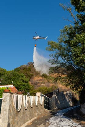 Wildfire erupts near Campi Flegrei volcanic area in Italy POZZUOLI, ITALY - JULY 13: An helicopter drops water over a wildfire on the outer edge of the Solfatara volcanic crater in the Campi Flegrei (Phlegraean Fields) volcanic region in Pozzuoli on July 13, 2026. The fire broke out in the undergrowth and quickly spread in the Pisciarelli area to several car dealerships, causing fuel tanks and tyres to explode. Eliano Imperato Anadolu Pozzuoli Italy. Editorial use only. Please get in touch for any other usage.  Copyright: x2026xAnadoluxElianoxImperatox