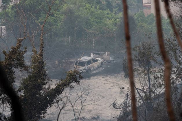 Wildfire erupts near Campi Flegrei volcanic area in Italy POZZUOLI, ITALY - JULY 13: A burnt-out car is seen as a big wildfire is seen in the Pisciarelli area located on the outer edge of the Solfatara volcanic crater in the Campi Flegrei (Phlegraean Fields) volcanic region in Pozzuoli on July 13, 2026. The fire broke out in the undergrowth and quickly spread to several car dealerships, causing fuel tanks and tyres to explode. Eliano Imperato Anadolu Pozzuoli Italy. Editorial use only. Please get in touch for any other usage.  Copyright: x2026xAnadoluxElianoxImperatox