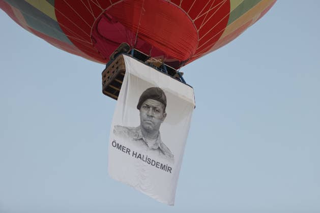 Cappadocia commemorates martyrs of 2016 defeated coup attempt NEVSEHIR, TURKIYE - JULY 14: Hot air balloons take off in Cappadocia carrying Turkish flags and banners featuring photographs of the 253 martyrs to commemorate July 15 Democracy and National Unity Day in Nevsehir, Turkiye on July 14, 2026. As part of the event organized by the Nevsehir Governorship, banners displaying Turkish flags and photographs of the martyrs were attached to the hot air balloons. Behcet Alkan Anadolu Nevsehir Turkey. Editorial use only. Please get in touch for any other usage.  Copyright: x2026xAnadoluxBehcetxAlkanx