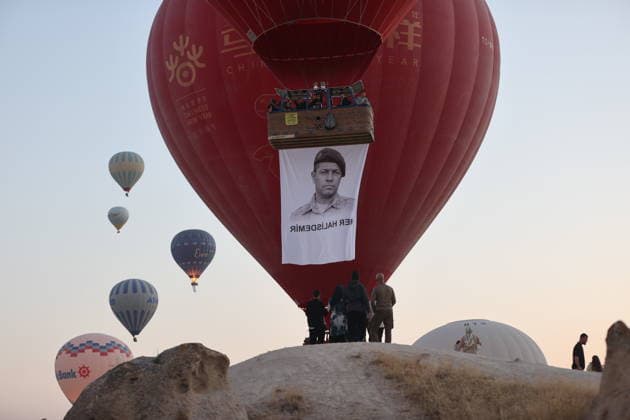 Cappadocia commemorates martyrs of 2016 defeated coup attempt NEVSEHIR, TURKIYE - JULY 14: Hot air balloons take off in Cappadocia carrying Turkish flags and banners featuring photographs of the 253 martyrs to commemorate July 15 Democracy and National Unity Day in Nevsehir, Turkiye on July 14, 2026. As part of the event organized by the Nevsehir Governorship, banners displaying Turkish flags and photographs of the martyrs were attached to the hot air balloons. Behcet Alkan Anadolu Nevsehir Turkey. Editorial use only. Please get in touch for any other usage.  Copyright: x2026xAnadoluxBehcetxAlkanx