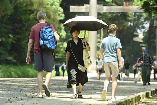 Extreme heat grips Tokyo as temperatures rise across eastern Japan TOKYO, JAPAN - JULY 14 : Visitors walk through the grounds of the Meiji Jingu shrine during hot weather in Tokyo, Japan, July 14, 2026. Temperatures in central Tokyo were forecast to reach 34 degrees Celsius. David Mareuil Anadolu Tokyo Japan. Editorial use only. Please get in touch for any other usage.  Copyright: x2026xAnadoluxDavidxMareuilx