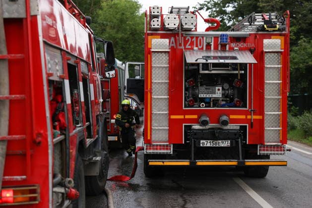 RUSSIA, MYTISHCHI - JULY 14, 2026: Fire crews at the scene of a fire at a residential house. Georgy Chernyshov TASS  95024352
