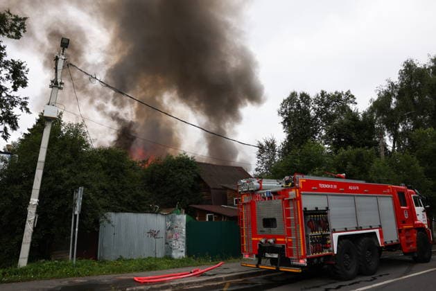 RUSSIA, MYTISHCHI - JULY 14, 2026: A fire engine at the scene of a fire at a residential house. Georgy Chernyshov TASS  95024515