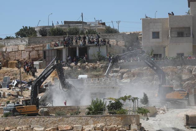 Israeli forces demolish Palestinian home in southern West Bank Israeli army vehicles demolish the home of Palestinian Osama Masaaf in the village of al-Deirat, east of Yatta, south of Hebron in the occupied West Bank, on July 14, 2026. Witnesses said the demolition took place during an Israeli military operation accompanied by heightened security measures. They added that Israeli forces used pepper spray to disperse Palestinians gathered at the scene, causing several people to sustain minor injuries. Photo by Mamoun Wazwaz apaimages Hebron West Bank Palestinian Territory 140726_Hebron_MW_00(21) Copyright: xapaimagesxMamounxWazwazx xapaimagesx