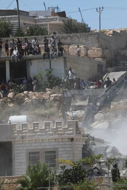Israeli forces demolish Palestinian home in southern West Bank Israeli army vehicles demolish the home of Palestinian Osama Masaaf in the village of al-Deirat, east of Yatta, south of Hebron in the occupied West Bank, on July 14, 2026. Witnesses said the demolition took place during an Israeli military operation accompanied by heightened security measures. They added that Israeli forces used pepper spray to disperse Palestinians gathered at the scene, causing several people to sustain minor injuries. Photo by Mamoun Wazwaz apaimages Hebron West Bank Palestinian Territory 140726_Hebron_MW_00(13) Copyright: xapaimagesxMamounxWazwazx xapaimagesx