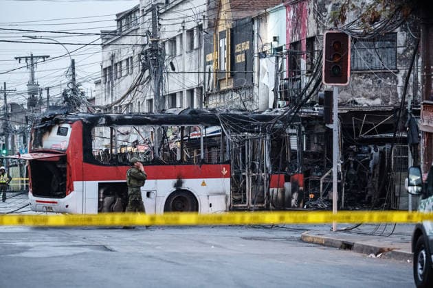 Santiago, July 14, 2026 A traffic accident involving a Red Electrico bus and a private vehicle at the corner of Santa Rosa and Franklin in the city of Santiago caused a fire in commercial establishments at that intersection. Diego Martin Aton Chile, Aton 1172297 jpeg  Copyright: DIEGOxMARTIN ATONxCHILE