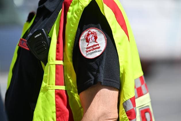 The Brussels firefighters logo pictured at the scene of a fire at the OXY building at place De Brouckere, in Brussels, Tuesday 14 July 2026s. The Brussels Labour Inspectorate confirms several bodies were found in the lift shafts, 6 people are still missing. The fire broke out on the second floor of the building that is currently being renovated.  EMILExWINDAL 181118572