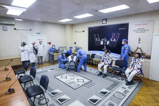 KAZAKHSTAN, BAIKONUR - JULY 14, 2026: ISS Expedition 74 75 prime crew members Roscosmos cosmonaut Pyotr Dubrov, NASA astronaut Anil Menon and Roscosmos cosmonaut Anna Kikina (L-R seated) are seen during a spacesuit check before the launch of the Soyuz-2.1a rocket booster carrying the Soyuz MS-29 spacecraft from Baikonur Cosmodrome. Sergei Savostyanov TASS  95030735