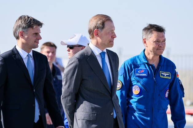 KAZAKHSTAN, BAIKONUR - JULY 14, 2026: Roscosmos General Director Dmitry Bakanov, Russia s First Deputy Prime Minister Denis Manturov and Gagarin Cosmonaut Training Centre head Oleg Kononenko (L-R) before the launch of the Soyuz-2.1a rocket booster carrying the Soyuz MS-29 spacecraft from Baikonur Cosmodrome Baikonur Kazakhstan  - ZUMAt113 20260714_zaa_t113_167 Copyright: xSergeixSavostyanovx
