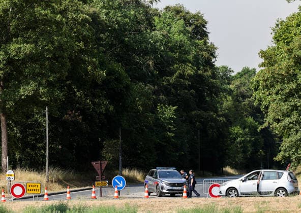 (260714) -- SEINE-ET-MARNE, July 14, 2026 -- A road is closed due to a wildfire in Seine-et-Marne, France, on July 14, 2026. French police have detained 59 people across the country in connection with wildfires, including two suspects linked to the blaze in the Fontainebleau forest in Seine-et-Marne department, southeast of Paris, French Interior Minister Laurent Nunez said on Monday. The wildfire in the Fontainebleau forest broke out on Sunday evening and continued to spread on Monday. ) FRANCE-SEINE-ET-MARNE-FONTAINEBLEAU-WILDFIRE WuxHuiwo 