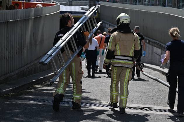 the scene of a fire at the OXY building at place De Brouckere, in Brussels, Tuesday 14 July 2026s. The Brussels Labour Inspectorate confirms several bodies were found in the lift shafts, 6 people are still missing. The fire broke out on the second floor of the building that is currently being renovated.  EMILExWINDAL 181122212