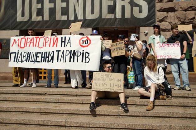 Activists call for a moratorium on the increase in municipal transport fares during the Preserve Affordable Transport in Kyiv rally outside the Kyiv City State Administration building, Kyiv, Ukraine, July 14, 2026. The capital plans to raise the fare for municipal transport to UAH 30 per single trip. The new tariffs will take effect from July 15, 2026. (Photo by Marianna Kotyk Ukrinform) Kyivans protest against municipal transport fare hike  Copyright: xMariannaxKotykx