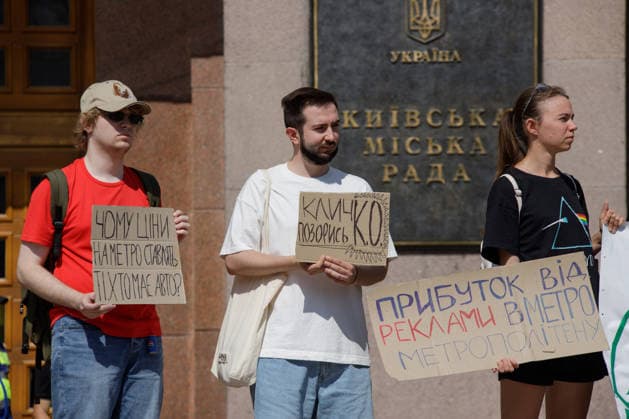Demonstrators protest against the increase in municipal transport fares during the Preserve Affordable Transport in Kyiv rally outside the Kyiv City State Administration building, Kyiv, Ukraine, July 14, 2026. The capital plans to raise the fare for municipal transport to UAH 30 per single trip. The new tariffs will take effect from July 15, 2026. (Photo by Marianna Kotyk Ukrinform) Kyivans protest against municipal transport fare hike  Copyright: xMariannaxKotykx