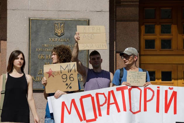 Demonstrators protest against the increase in municipal transport fares during the Preserve Affordable Transport in Kyiv rally outside the Kyiv City State Administration building, Kyiv, Ukraine, July 14, 2026. The capital plans to raise the fare for municipal transport to UAH 30 per single trip. The new tariffs will take effect from July 15, 2026. (Photo by Marianna Kotyk Ukrinform) Kyivans protest against municipal transport fare hike  Copyright: xMariannaxKotykx