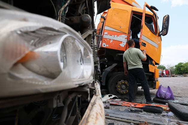 RUSSIA, LUGANSK - JULY 14, 2026: Destroyed vehicles are seen after a military strike on a parking lot with civilian trucks. Alexander Reka TASS  95028658